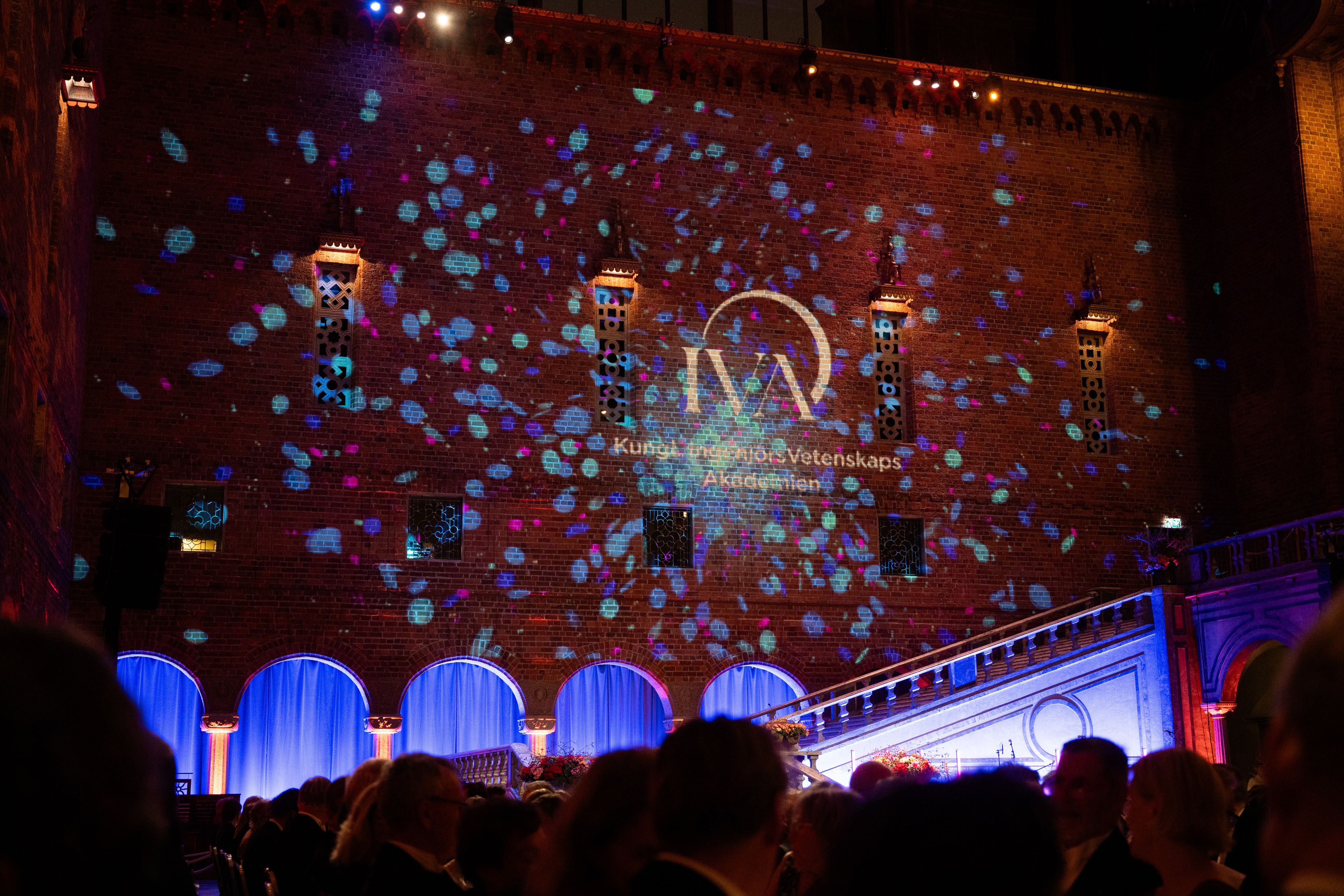 IVA logo projected on wall in City Hall