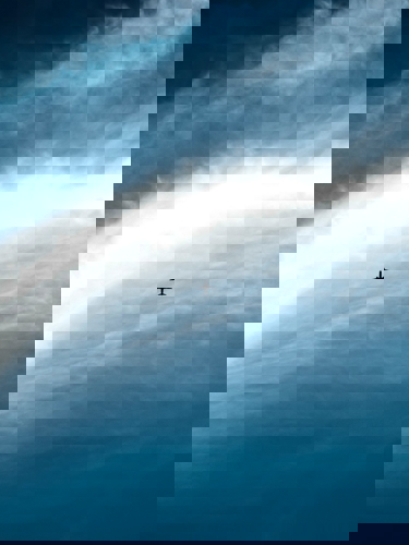 clouds in the sky and small airplane