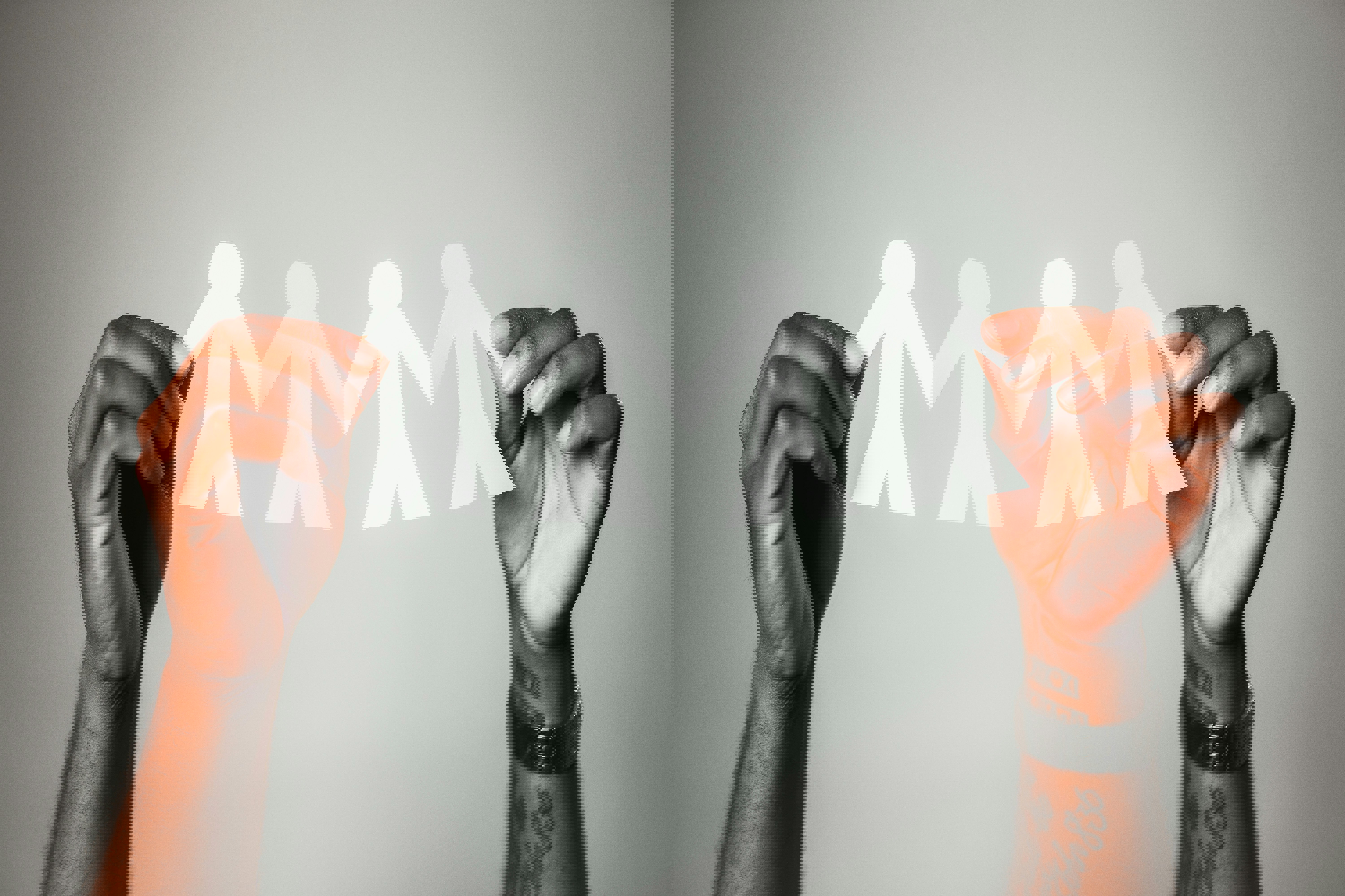 hands holding chain of paper figures